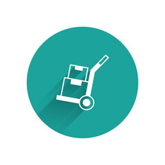 White Hand truck and boxes icon isolated with long shadow background. Dolly symbol. Green circle button. Vector