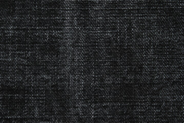 Black washed denim texture close up as background