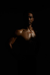 Fototapeta na wymiar Topless, muscle and portrait man in dark background for fitness inspiration, beauty aesthetic or strong body. Shadow aesthetic, topless male model or body builder in creative studio with art lighting
