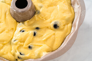 Lemon blueberry bundt cake with powdered sugar dusting