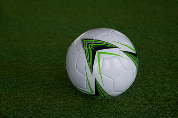 Soccer ball on a background of green grass. close-up image.