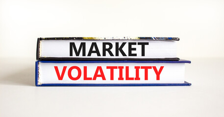 Market volatility symbol. Concept words Market volatility on beautiful books. Beautiful white table white background. Business market volatility concept. Copy space.