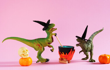 Two funny dinosaurs wearing witch hats are brewing potion in pot on  pink background. Halloween...