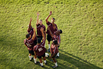 Raised hand, sports and rugby people celebrate teamwork, team building or winning game, match or...