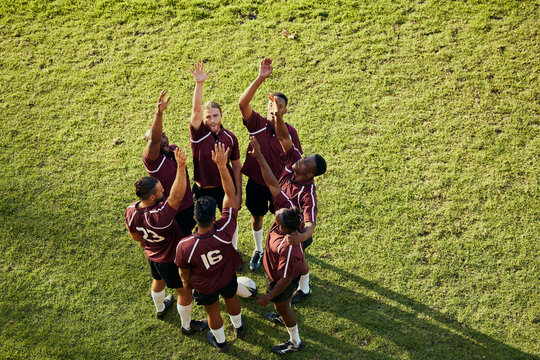Raised hand, sports and rugby people celebrate teamwork, team building or winning game, match or tournament competition. Success motivation, top view winner and circle of men happy, excited or cheers