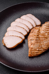 Delicious juicy grilled chicken fillet with salt, spices and herbs