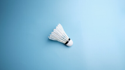 Close-up single shuttlecock on a background blue