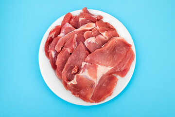 Raw turkey boneless thigh chunk on plate