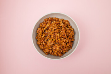 Bowl of boiled red lentils in a ceramic bowl