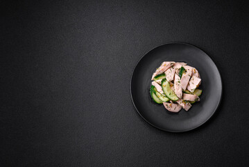 Delicious juicy fresh salad of cucumbers and grilled chicken slices, with french mustard