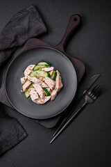 Delicious juicy fresh salad of cucumbers and grilled chicken slices, with french mustard