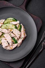 Delicious juicy fresh salad of cucumbers and grilled chicken slices, with french mustard