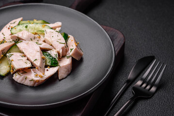 Delicious juicy fresh salad of cucumbers and grilled chicken slices, with french mustard