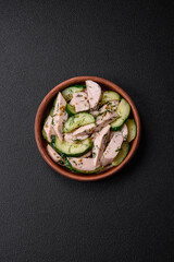 Delicious juicy fresh salad of cucumbers and grilled chicken slices, with french mustard