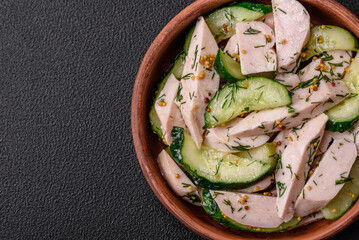 Delicious juicy fresh salad of cucumbers and grilled chicken slices, with french mustard