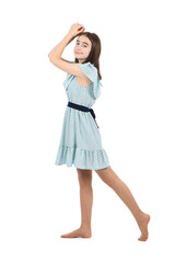 Young beautiful girl in a dress with polka dots on a white background.