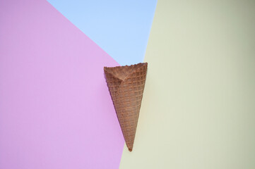 Ice cream cone on a pastel colorful background. Isolated. Top angle. Minimal summer concept. Flat lay. Perfect for background.