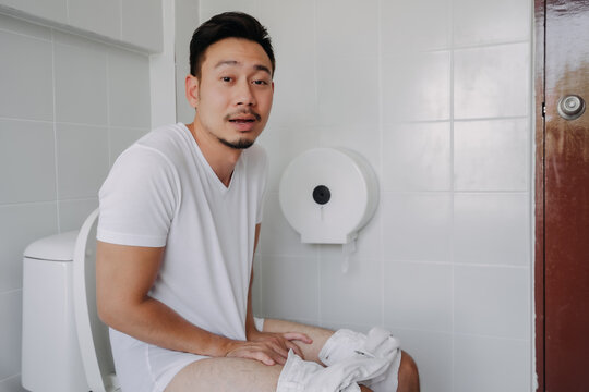 Funny Happy Face Of Asian Man Able To Poop After Suffer From Constipation.