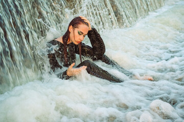 Girl dressed as a pilot in the water summer 2023