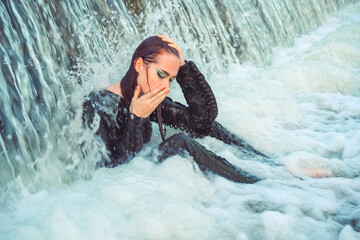 Girl dressed as a pilot in the water summer 2023