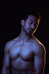 Fototapeta na wymiar Topless, dark and sexy man on black background in fitness inspiration, beauty aesthetic or strong fantasy. Bodybuilder art, body and seductive male model with muscle, studio and neon blue lighting