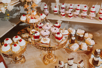 A delicious wedding. Candy bar with various chocolates. Fruit table. Celebration concept. Fashionable desserts. Table with sweets, candies.