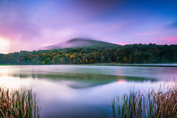 Sunrise over Sharptop Mountain and Aboott Lake, Peaks of Otter, Blue Ridge Parkway national park, Virginia.