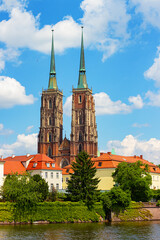 Cathedral of st. John the Baptist (aka Katedra sw. Jana Chrzciciela) and Archbishop's Palace on Ostrow Tumski, historic old town quarter in Wroclaw, Poland - obrazy, fototapety, plakaty