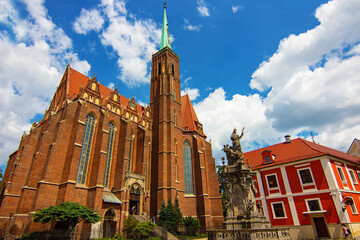 Collegiate Church of the Holy Cross and St. Bartholomew and Pastoral Center of the Archdiocese of Wroclaw on the Ostrow Tumski in Wroclaw, Poland. - obrazy, fototapety, plakaty