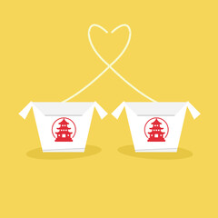 Chinese take out boxes with noodles forming a heart. In love concept. First date meal. 