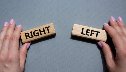 Right or Left symbol. Concept word Right or Left on wooden blocks. Businessman hand. Beautiful grey background. Business and Right or Left concept. Copy space