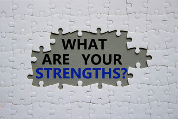 What are your Strengths symbol. White puzzle with words What are your Strengths. Beautiful grey...