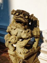 An ancient statue of a mythical creature made in the East Asian style, decorative sculpture.