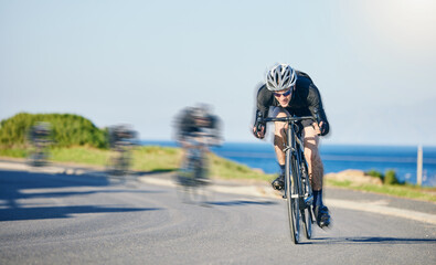 Fototapeta premium Motion blur, race and cyclist on bike on road in mountain with helmet, exercise adventure trail and speed. Cycling action , nature and men with bicycle for fast workout, training motivation or energy