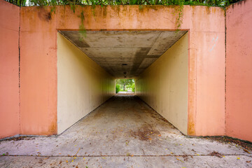 Pedestrian tunnel in a park under a bridge