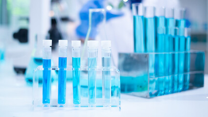Laboratory glassware and scientific backgrounds, extensive research in science medicine, biology and biotechnology chemistry and scientific exploration. Liquid samples analyzed in test tubes