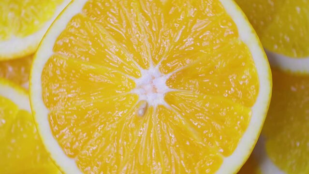 Close-up of orange slices spinning in a circle. Fruit orange.