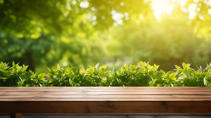 Empty wooden table for product placement with blurred garden grass background