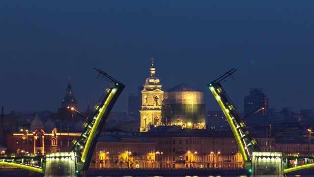 Timelapse from Trinity Bridge captures the night view of opened Birzhevoy Bridge and Tserkov' svyatoy velikomuchenitsy Ekateriny in Saint Petersburg, Russia