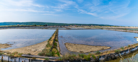 A panorama view across active crystallisation pools at the salt pans at Secovlje, near to Piran,...