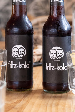 Two Fritz Kola bottles on a table, fresh German cola.