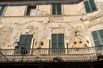 Asciano, Tuscany - Facade of an old medieval house - 640783989
