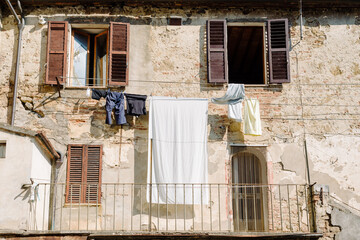 Asciano, Tuscany - Facade of an old medieval house - 640784166