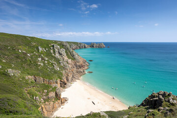 Beautiful calm day from the south west coast path in Cornwall at Portcurno looking towards Logan Rock from Carn Kizzie.