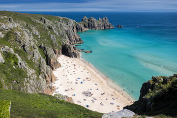 View from the South West Coast Path looking down on Treen Bay with Logan Rock behind.