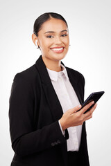 Fototapeta na wymiar Portrait, phone and earphones with a business woman in studio on a white background for communication. Smile, networking and music with a happy young employee typing a text message on her mobile