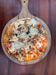 photo of pizza from above, pizza is on the table
