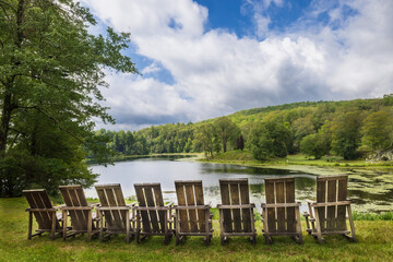 Adirondack chairs overlook a lake at the Innisfree Garden in Millbrook, New York.