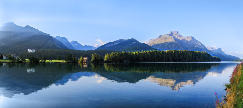 Lake Sils and the Chaste island in the morning with reflection in Sils Maria / Segl, St Moritz, Canton Grisons, Switzerland