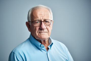Portrait of senior man wearing a blue shirt